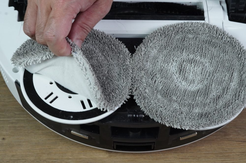 Peel the mop pad off the hook-and-loop fastener.